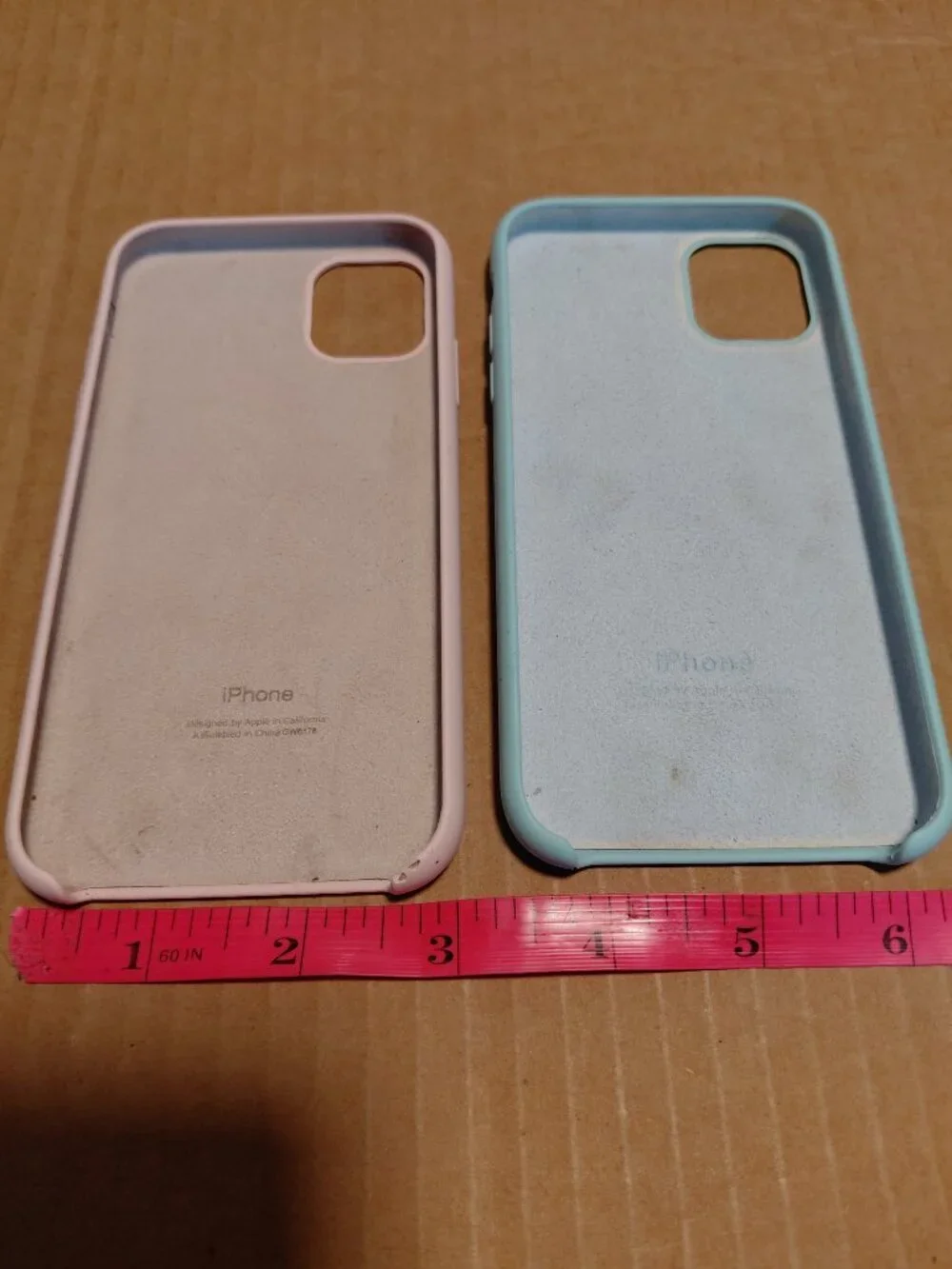 Apple silicone phone cases for the iPhone 11 Pro in light pink and seafoam green